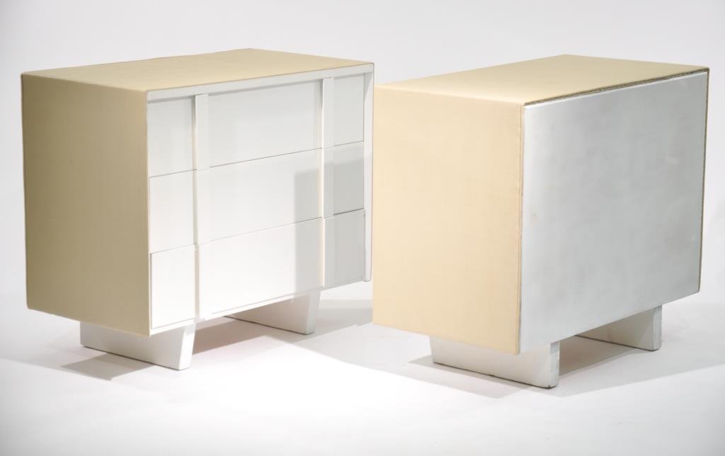 PAIR OF KARL SPRINGER STYLE CHESTS: White painted and snake skin fabric covered. Dimensions: H 32" x W36" x D 19.5" Condition: Good, small chips to paint.