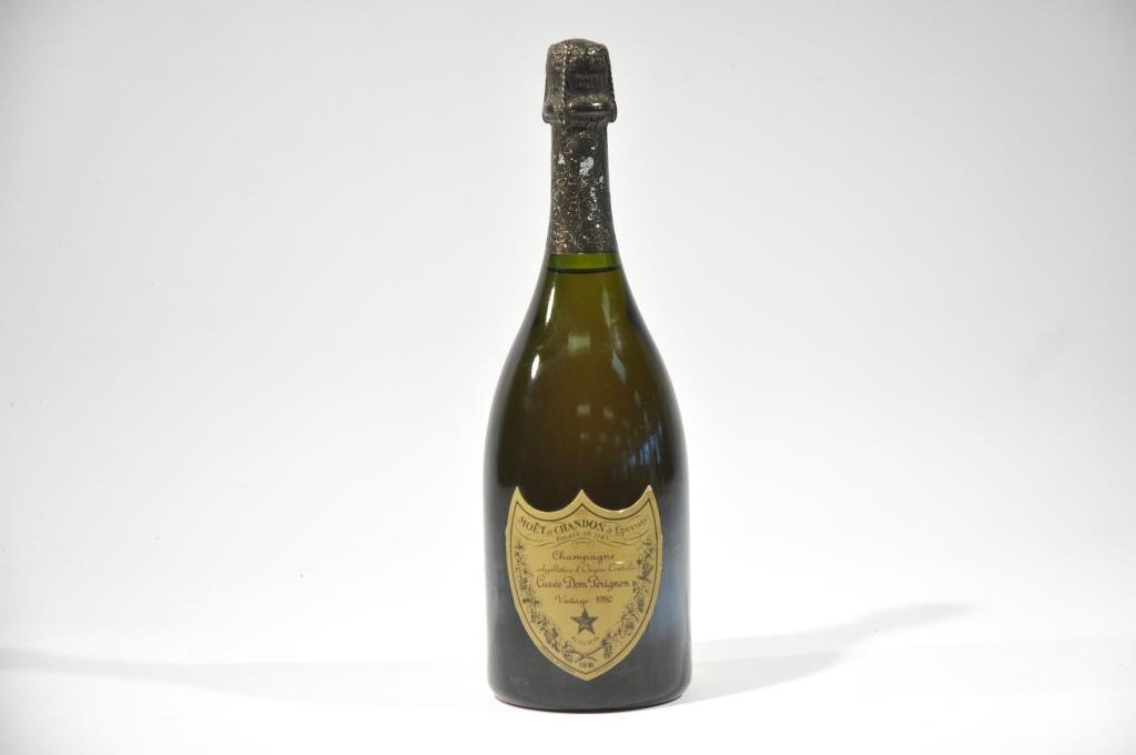 MOET & CHANDON DOM PERIGNON CHAMPAGNE: 1980 Moet & Chandon Dom Perignon Brut, Champagne, France, 750mlDimensions: H 12"Condition: Appears good, still produces bubbles.