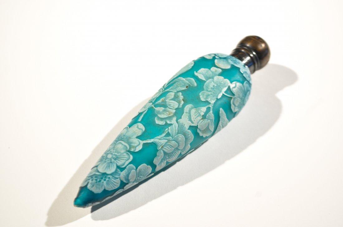WEBB ENGLISH BLUE CAMEO GLASS SCENT PERFUME BOTTLE: White to blue cameo glass with flowers and foliage. Attributed to Thomas Webb & Sons but unsigned. Sterling silver top by Charles Moss, England,19th Century.Dimension: H 6" x W 1.75" Condition: Tip ha