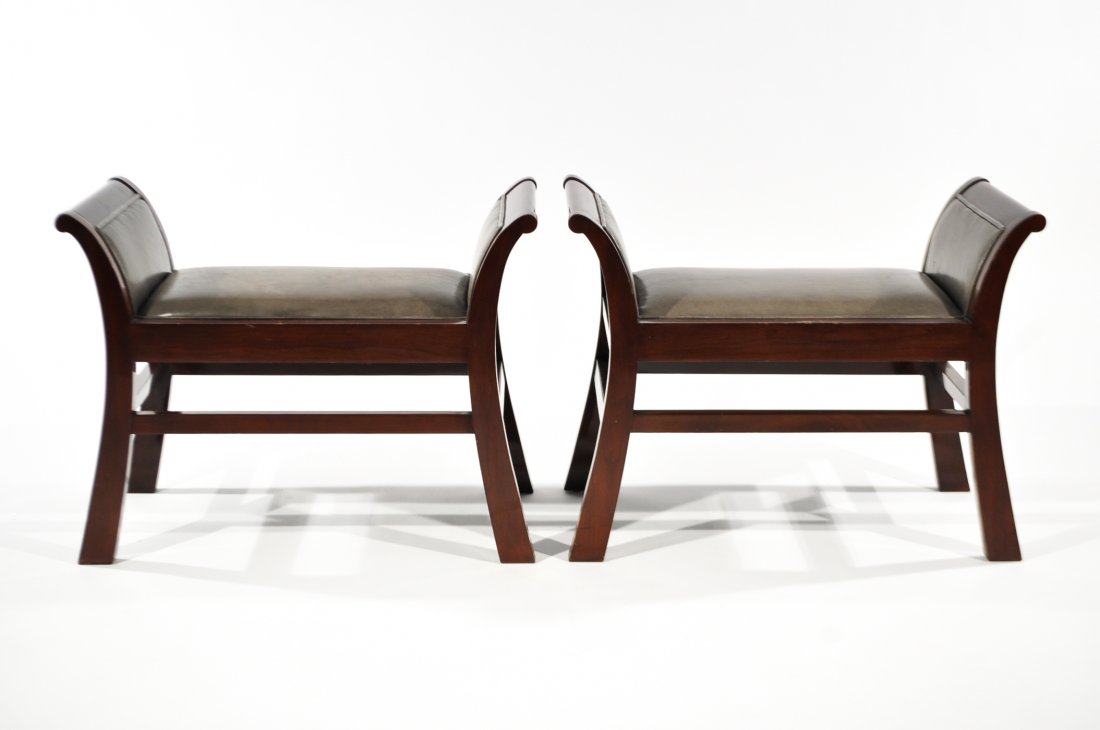 JOHN WIDDICOMB, TWO BENCHES: USA, 1990s, lacquered mahogany, leather, metal labelsDimensions: H 23" x W 30" x D 16"Condition: Some light chips to edges and wear to leather. Otherwise very good original condition.