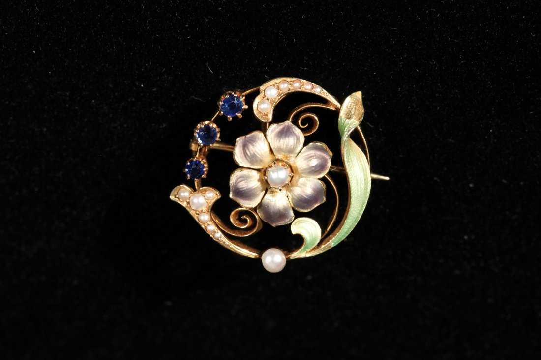 14K VINTAGE ENAMEL, GOLD, PEARL & SAPPHIRE BROOCH: 14K yellow gold, blue sapphire, pearl and enamel brooch. The art nouveau brood has a diameter of approx 1 inch and has a floral theme. it is prong set at teh top with 3 Old Mine cute blue sapphires. T