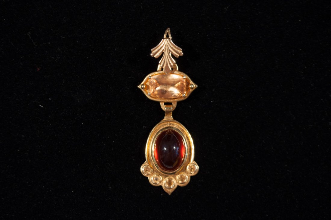 22K GOLD, GARNET & CITRINE PENDANT: The top of the enhancer is in the shape of a carved upside down leaf. it connects to a horizontally prong set citrine. The citrine measures approx 11.50x7.50x4.20mm and weighs approx 2.15 carats. The 