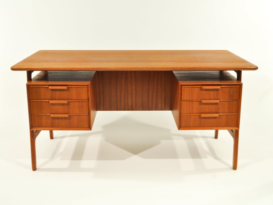 GUNNI OMANN JR. TEAK DESK: Label to inside drawer Omann Jun A/S Model Nr. 75, Danish, Circa 1960sDimensions: H 29" x W 60" x D 32"Condition: overall very good, two light surface scratches to top