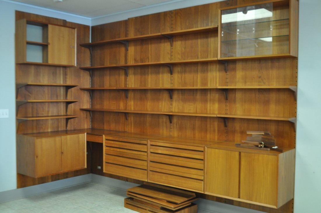 POUL CAVODIUS "CADO" TEAK WALL UNIT: 5.5 bay wall unit, 4 cabinets, 2 wall shelf cabinets, and 2 smaller cabinet inserts (one is a vanity the other is a 2 drawer piece)Each bay measures 93" height, 31.5" width. One bay (in the left side 