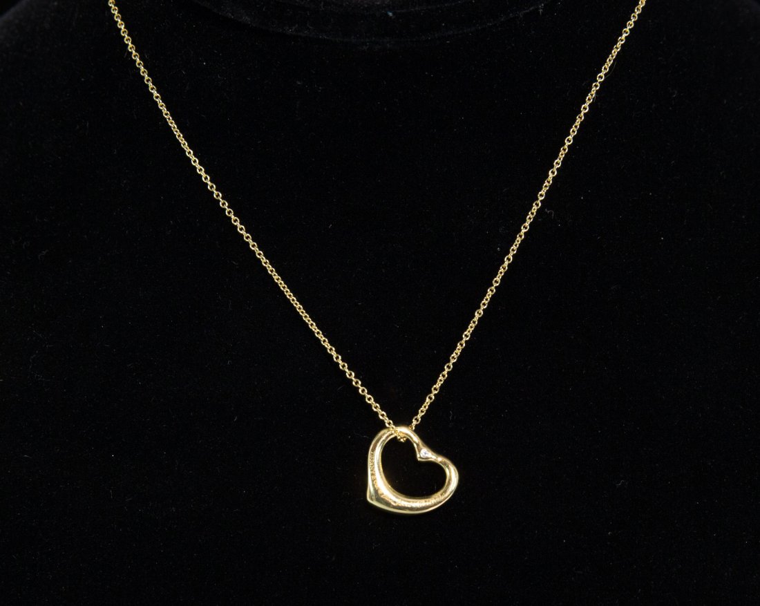 18K GOLD ELSA PERETTI TIFFANY HEART NECKLACE: Chain and pendant marked 750 with makers mark, pendant with diamond on each side. Dimensions: Length 15.5" Heart: 15mmCondition: good