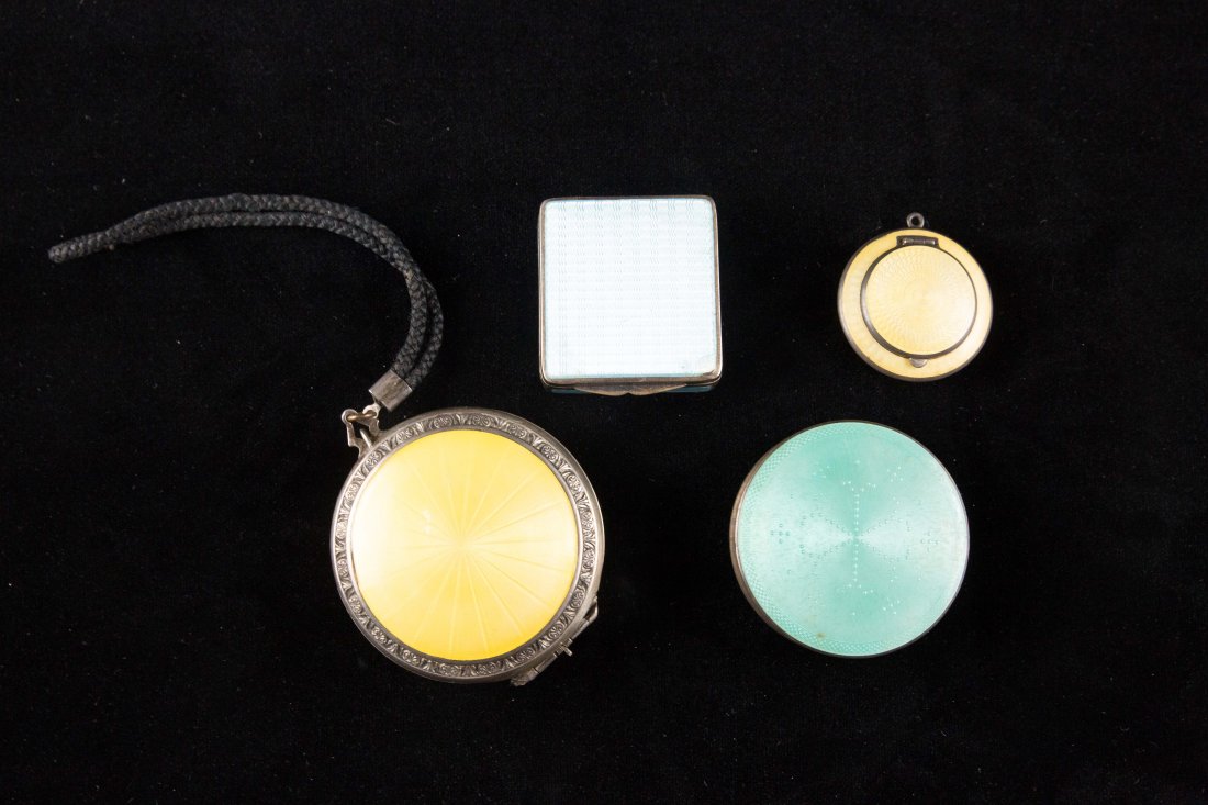 (4) GUILLOCHE ENAMEL SILVER COMPACT BOXES: Including blue sterling silver guilloche, 935 silver yellow guilloche pill box, 925 mint compact, sterling silver yellow compact. Dimensions: Largest yellow: D 2.5"Condition: Some chips and scratching