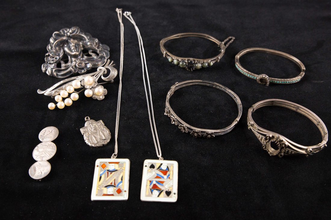 GROUPING OF STERLING: Including 4 sterling mourning bangle bracelets with turquoise, pearl and cats eye. Also includes large sterling silver Art Nouveau lady face brooch and 4 misc pieces.Condition: As is, most needs repai