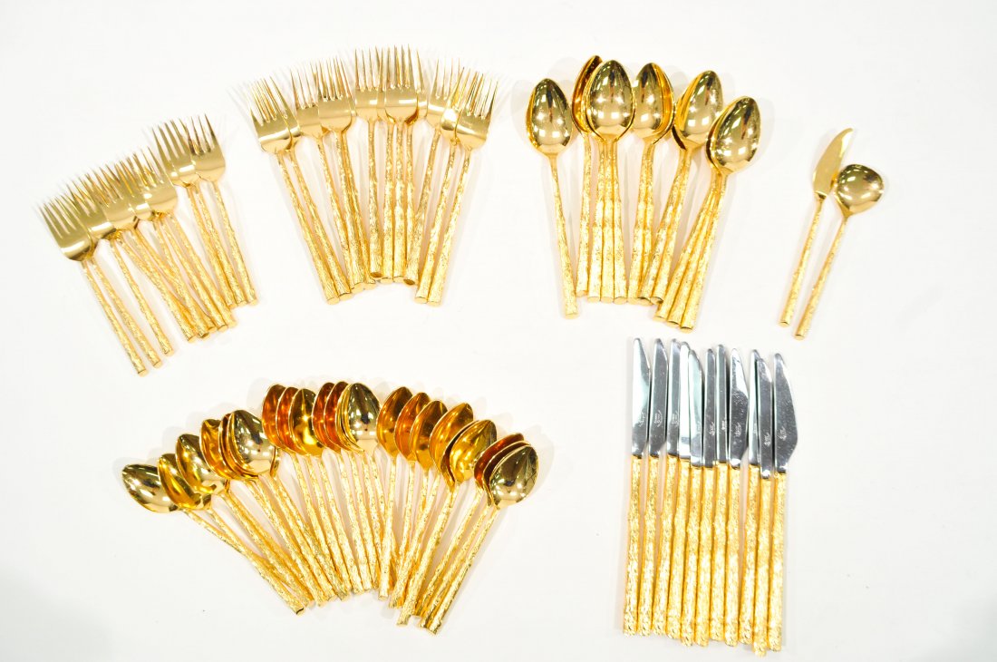 MID-CENTURY COSMOS GOLD PLATED FLATWARE SET: Marked Cosmos, Japan, purchased at Carole Stupell, "Bark" patternSetting of 12, missing one knifeCondition: good