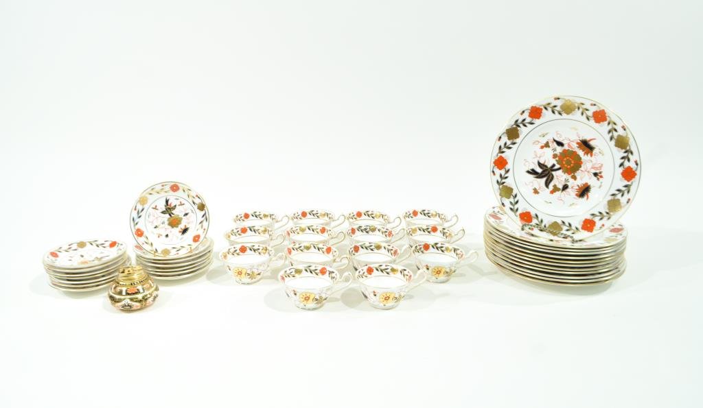 ROYAL CROWN DERBY PORCELAIN TEA SET: Lunch set including: 12 cups and 14 saucers, 12 10.5" plates and a table lighter. Marked XXVII 8687Condition: Good, light knife marks to center of plates