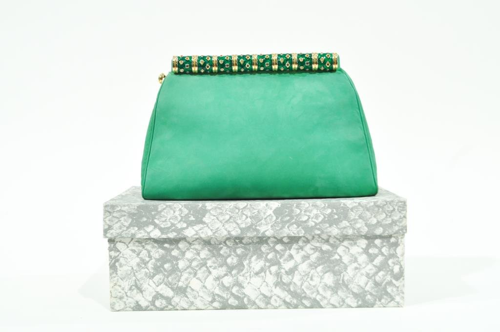 JUDITH LEIBER PURSE: With green enameled handle, original box, mirror, dust bag, comb and change purse. Dimensions: H 6" x W 9.5" x W 3"Condition: Very good, like new