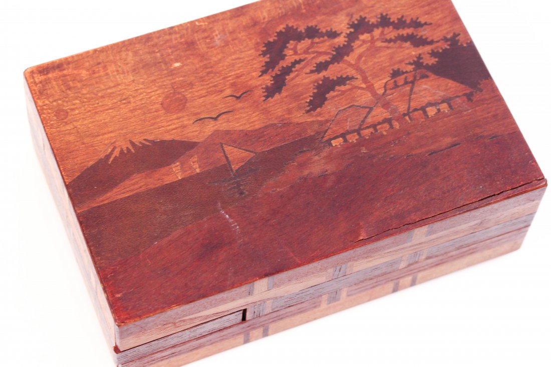 JAPANESE INLAID WOODEN HIDDEN PUZZLE BOX: Marked IV KA SE SEI to backDimensions: H 2" x W 5.75" x D 4"Condition: good, some wear to veneer