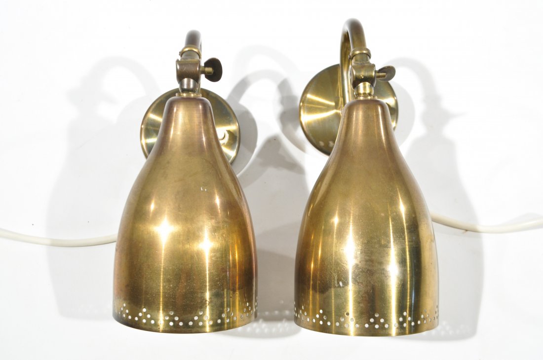 PAAVO TYNELL STYLE SCONCES: Pierced brass with swivel heads. Dimensions: H 8" x D 3"Condition: Good, very light tarnishing.