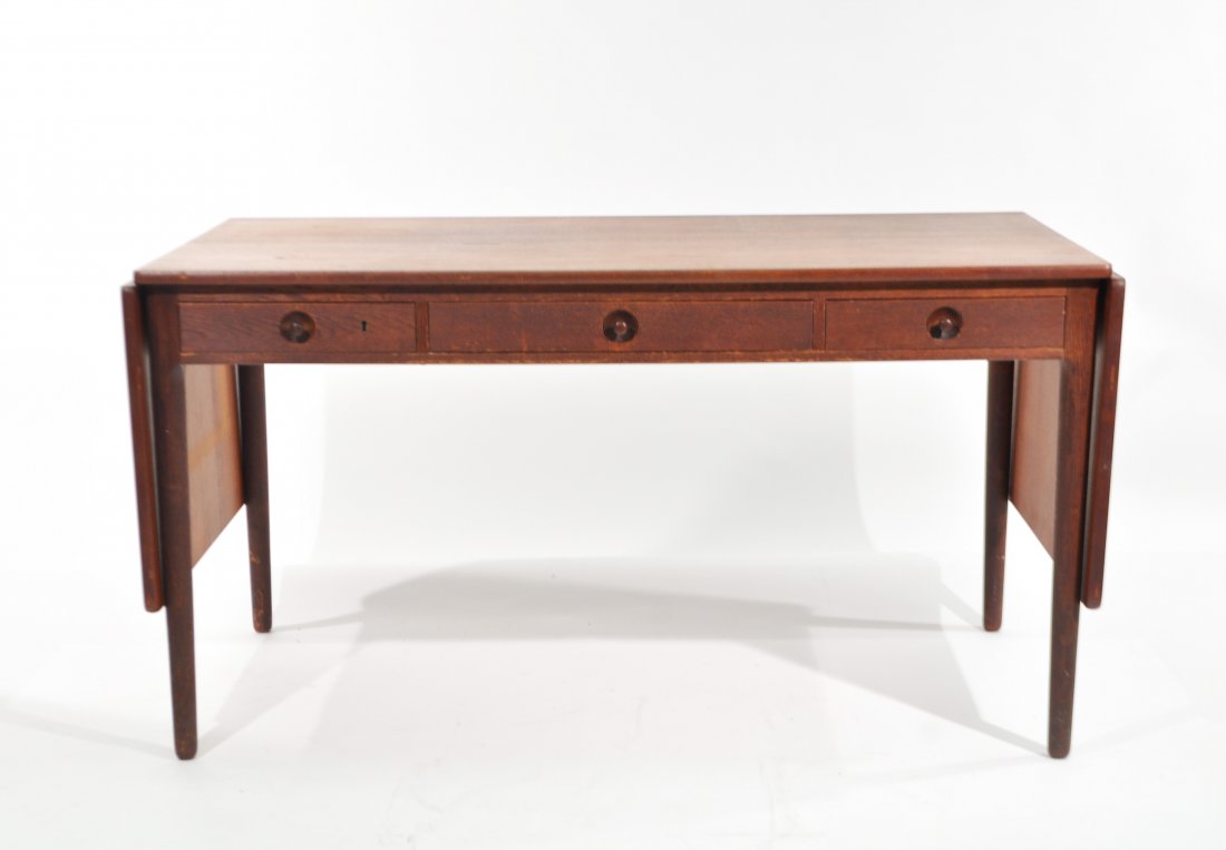 HANS J. WEGNER FOR ANDREAS TUCK DROP LEAF DESK: Dimensions: H 29" x W 55" x D 30", (2) 19" leavesCondition: good, small loss to left drawer, wear from use to finish on top