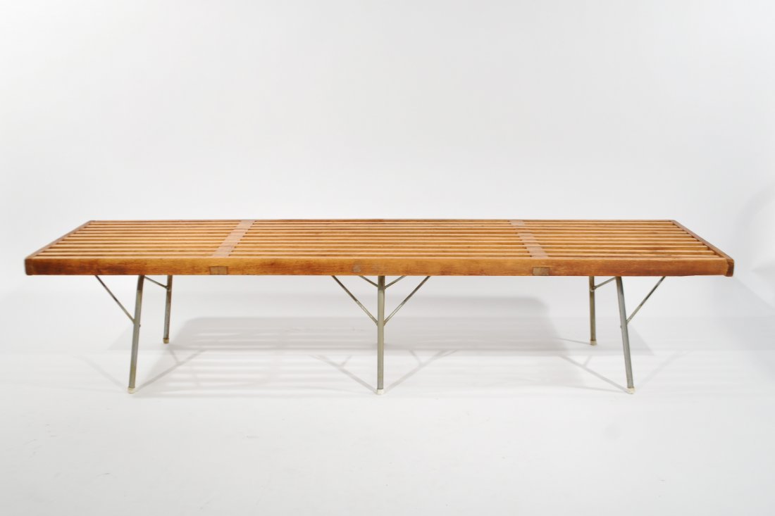 GEORGE NELSON BENCH FOR HERMAN MILLER: Rectangular top of pierced form, raised on chromed steel tubular legs joined by stretchers, with a George Nelson label.Dimensions: H 15" x W 57.5" x D 18.5"Condition: needs refinishing overall sturdy 