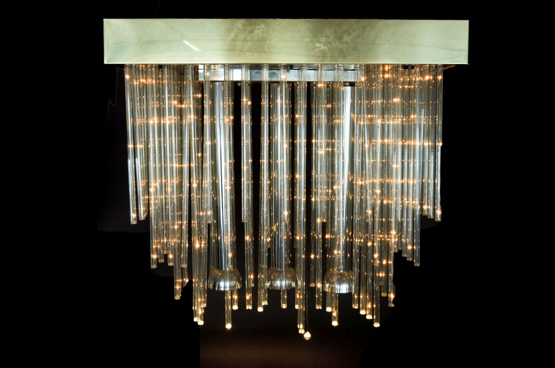 LIGHTOLIER TIERED LUCITE ROD CHANDELIER: Attributed to Sciolari tiered Lucite rods with chrome balls and brass mounts. Dimensions: H 27" x W 30" x D 16"Condition: Good working normal signs of age.