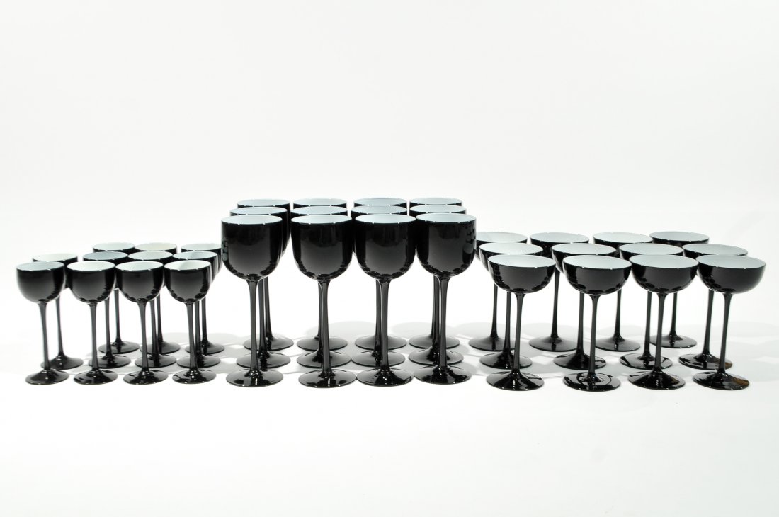 SET OF 12 BLACK CASED GLASS WINE GOBLETS: 35 glasses total attributed to CARLO MORETTI. Set of 12 short one smaller glass. Dimensions: H 9" x D 3.5"Condition: Good, some small fleck chips to rims