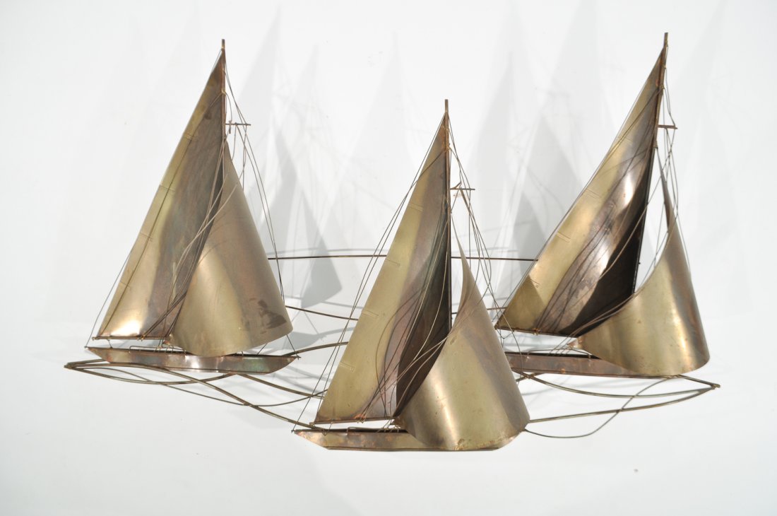 MID-CENTURY CURTIS JERE SAILBOAT WALL SCULPTURE: Signed C. Jere 77 to baseDimensions: H 30" x W 52" x D 8"Condition: good vintage condition