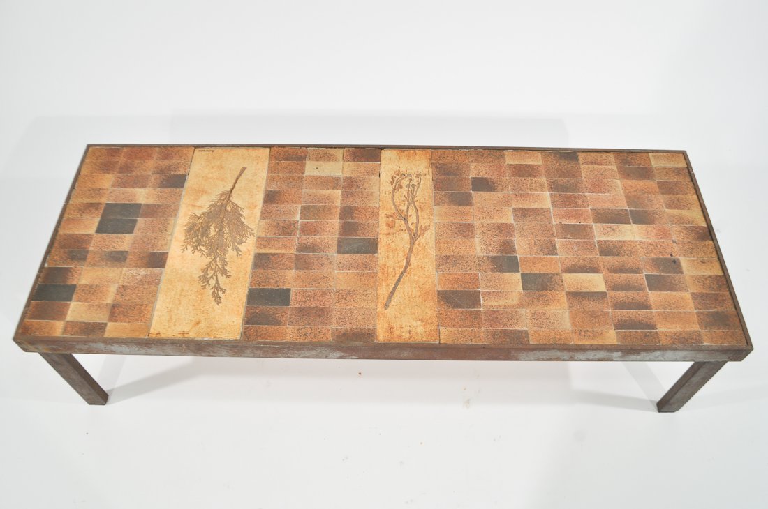 ROGER CAPRON COFFEE TABLE: Signed to tileDimensions: H 11.5" x W 47" x D 17.25"Condition: good, some rust to base