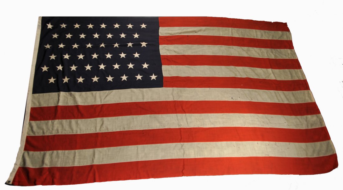LARGE 46 STAR FLAG: Dimensions: H 70" x W 112"Condition: vintage and flown, some tattering and holes