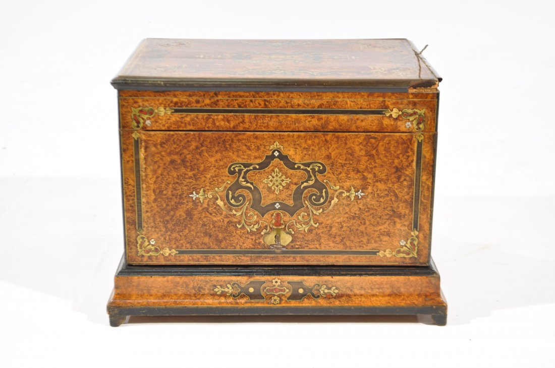 TANTALUS SET: Dimensions: H 10.5" x W 14" x D 11"Condition: lifting to a metal inlay on top, missing trim pieces to corner of lid, some wood panels to inside, lacking any bottles