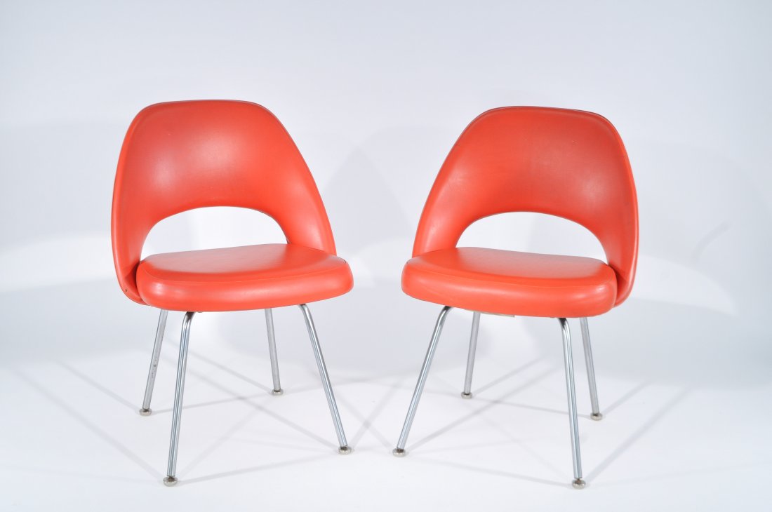 PAIR OF MID-CENTURY EERO SAARINEN EXECUTIVE CHAIRS: Knoll International Label, original vinylDimensions: H 32.25" x W 22" x D 18"Condition: some small tears and holes on backrest