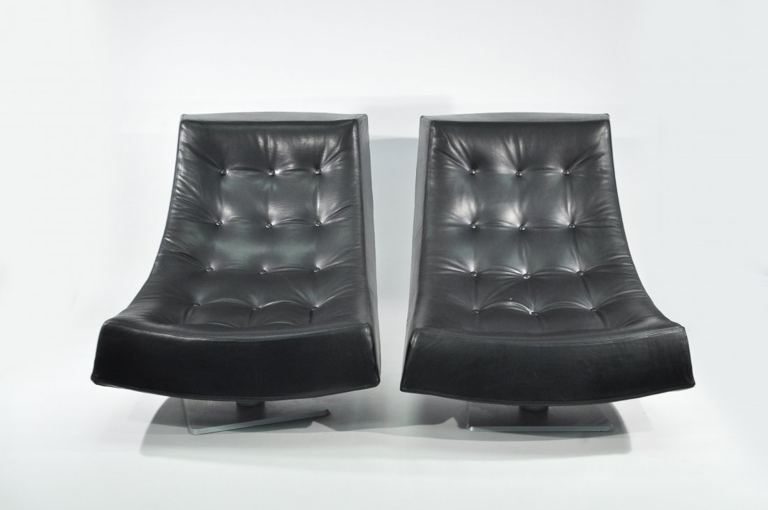 PAIR OF MODERN SCOOP CHAIRS: Leather, on metal baseDimensions: H 37" x W 35" x D 48"Condition: very good, clean, and plush