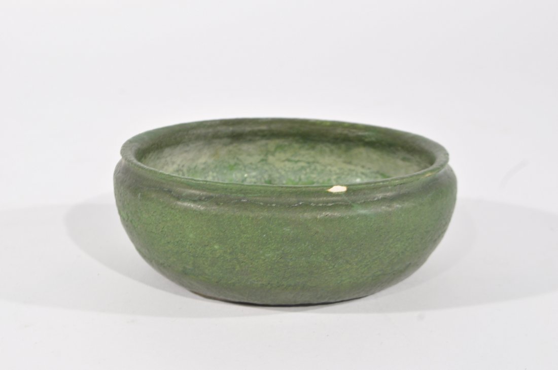 GRUEBY ART POTTERY BOWL: With Grueby mark to bottom, in a thick matte green glazeDimensions: H 2" x Diameter 6"Condition: fair, four small chips total around rim, three have been colored in