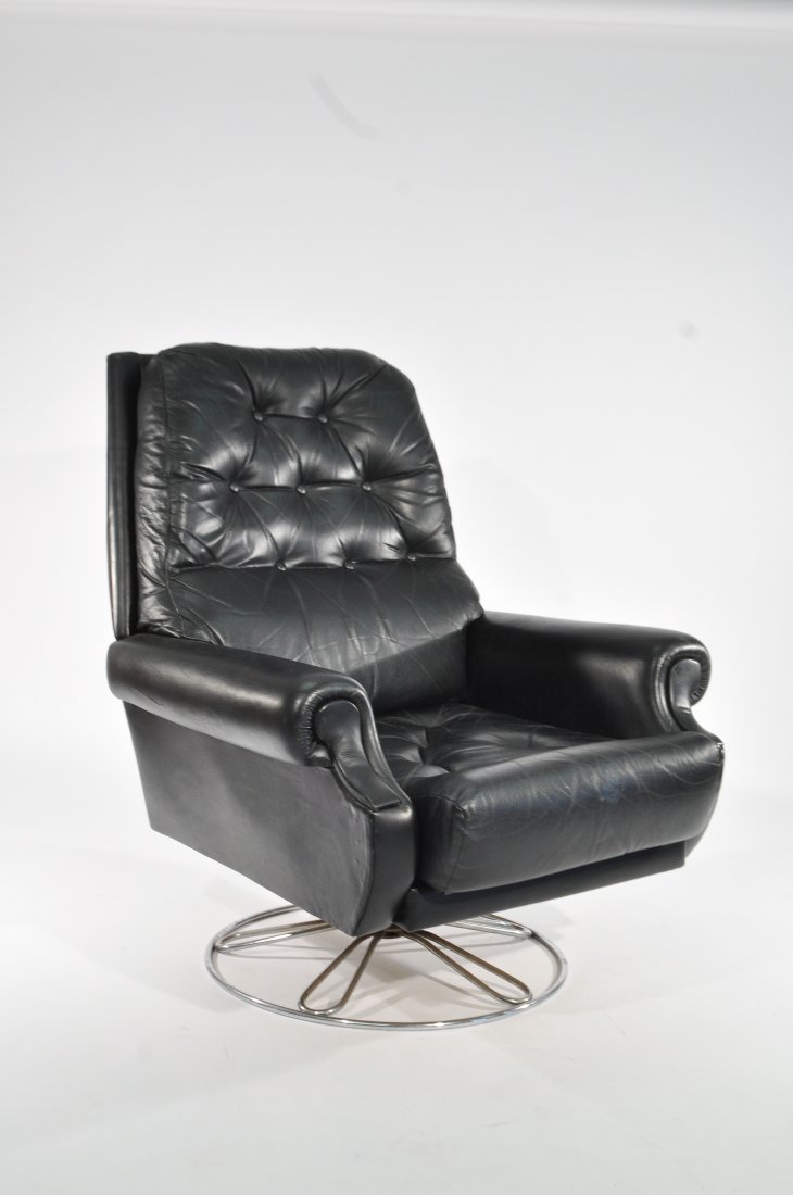 MID-CENTURY SWIVEL LOUNGE CHAIR: Dimensions: H 40" x W 31" x D 39"Condition: lacking some tufts, some wear to vinyl in places, plush, light rust to base