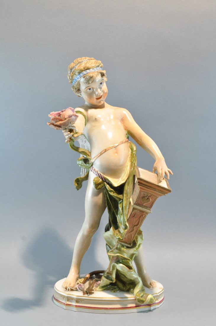 KPM CHERUB CERAMIC FIGURE: Marked to bottom Dimensions: H 15.5" x W 7" x D 7" Condition: repair to flower and orange planter