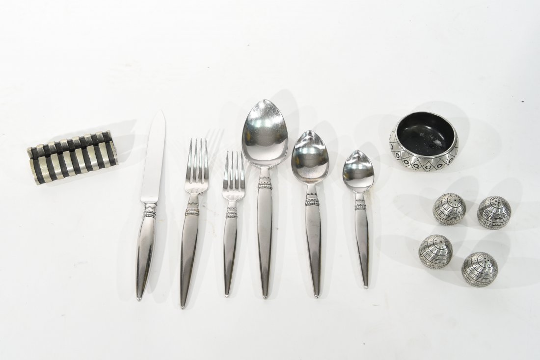 LISA JENKS STAINLESS SERVICE FOR 14: Lisa Jenks for Sasaki, all marked, service for 14 including some extras, two sets of salt and peppers, a place card holder, bowl, serving utensils, etc Condition: good, some scuff marks here and there