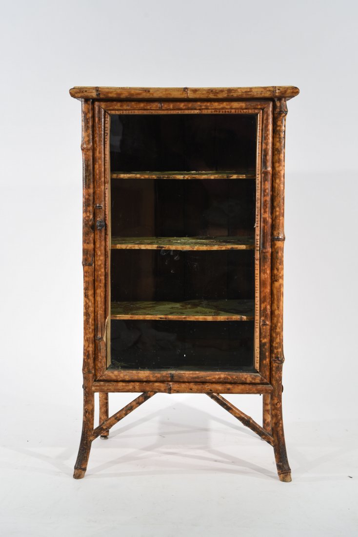 ENGLISH CHINOISERIE BAMBOO & GLASS CABINET: Diminutive "burnt bamboo" cabinet from the late 19th century. Victorian/Edwardian period. Dimensions: H 36" x W 21" x D 14.5" Condition: Losses to top. Needs some work.