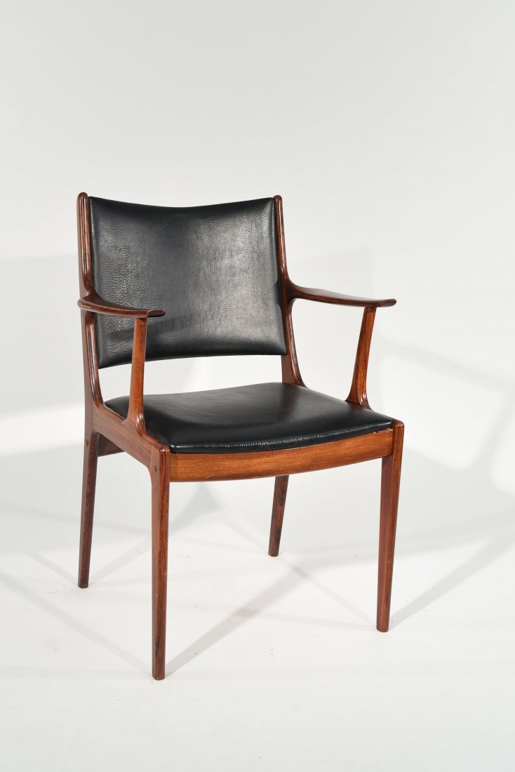 JOHANNES ANDERSON ROSEWOOD ARMCHAIR: Dimensions: H 32.5" x W 21" x D 17.5"Condition: Good. Some light scratches. Presents well. Paint stain on back as well as small puncture hole to synthetic on back side.