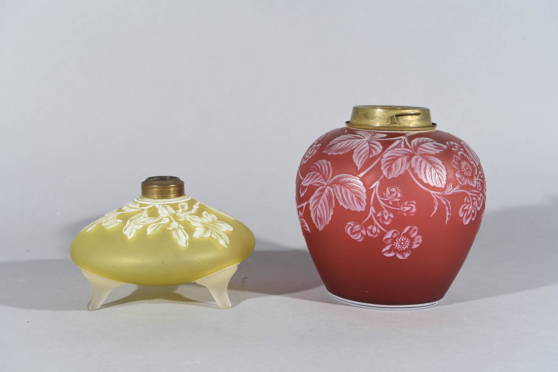 TWO WEBB CAMEO GLASS LAMP BASES: One small oil lamp yellow and white design with legs, signed on the bottom.One oil lamp red and white with design Both are marked on the bottom acid etched: THOMAS WEBB & SONS CAMEO Dimensions: (red b