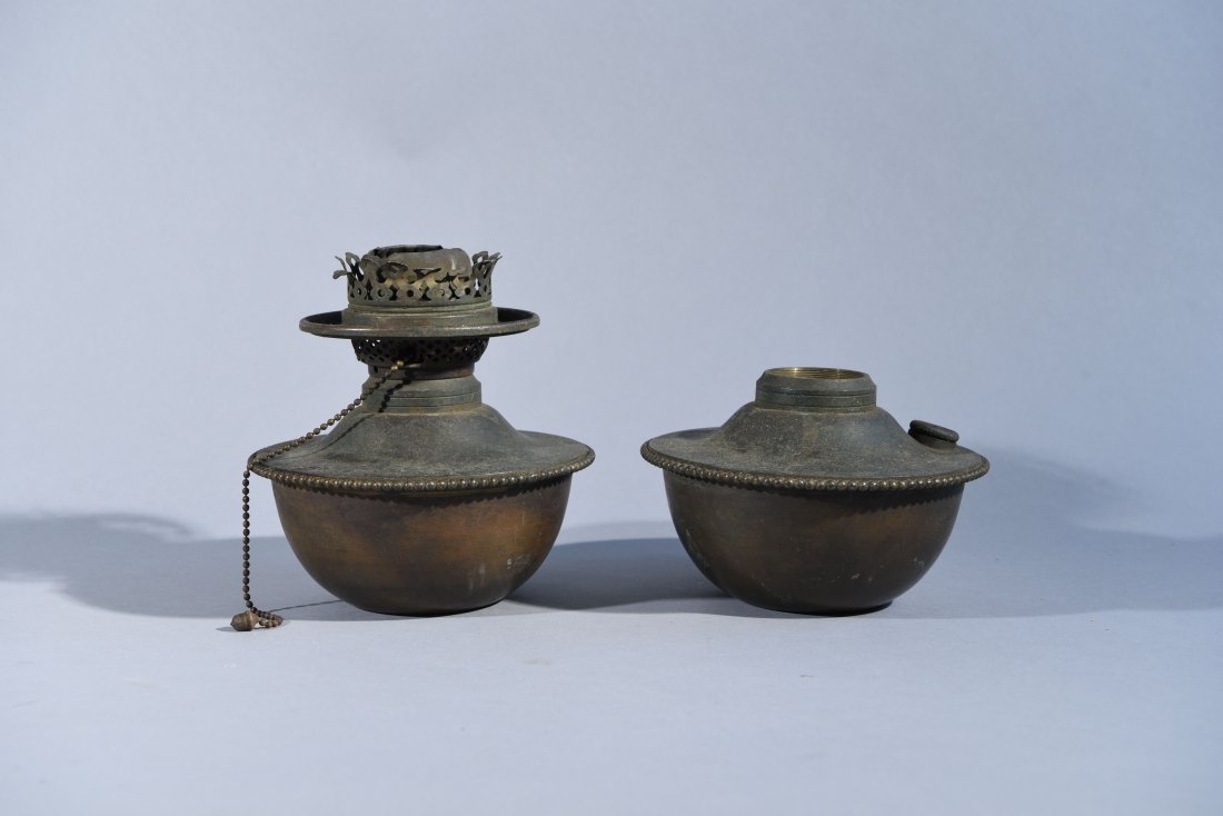 TWO TIFFANY OIL LAMP FONTS: Stamped on the bottom TIFFANY STUDIOS, NEW YORK Dimensions: H 6.75" x D 6.5" (tallest) Condition: Good, some bends in accents of taller.