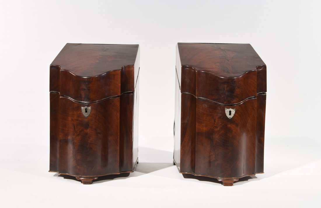 GEORGE III MAHOGANY SERPENTINE KNIFE BOXES: Late 18th c. silvered brass escutcheons, retains fitted interiors.Dimensions 15.25" H x 8 7/8 W x 13" DCondition: some old filled in cracks on the surface consistent with age.