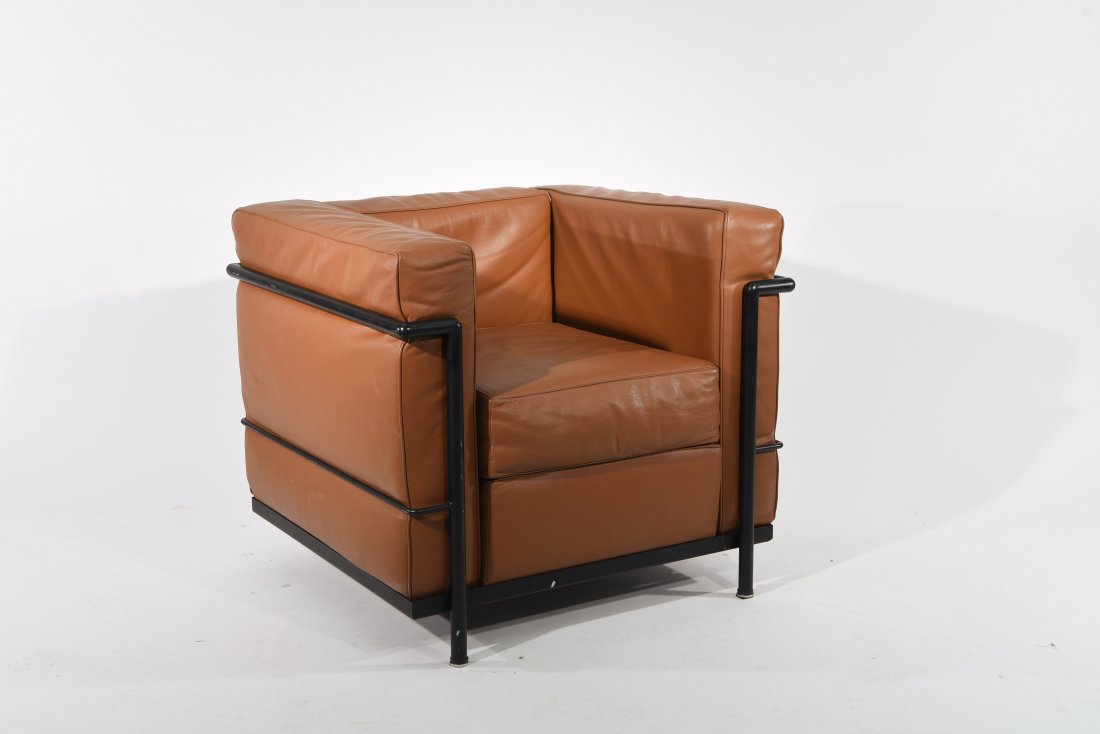 ITALIAN LE CORBUSIER STYLE LEATHER LOUNGE CHAIR: Quality leather and black enameled tubular frame, unmarked Dimensions: H 27" x W 30" x D 27" Condition: good, scuffs to paint on frame, cushions are plush