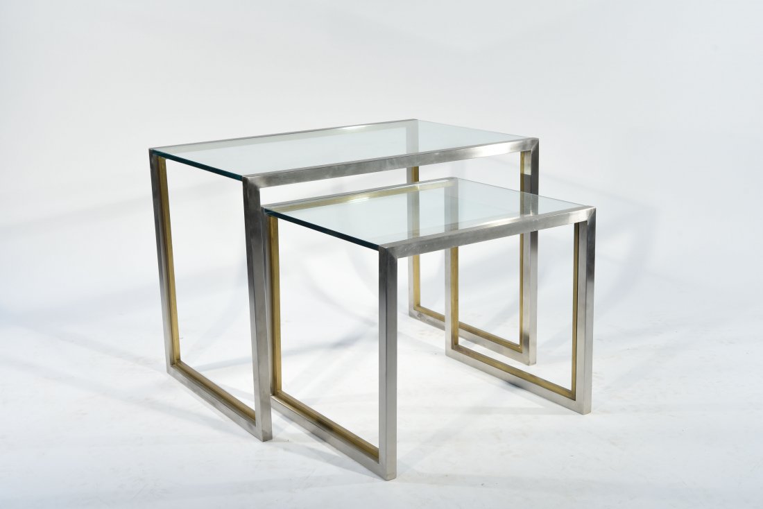 TWO STAINLESS & BRASS NESTING END TABLES: Dimensions: Larger: H 22" x W 30" x D 30"Condition: Brass is aged from normal use.