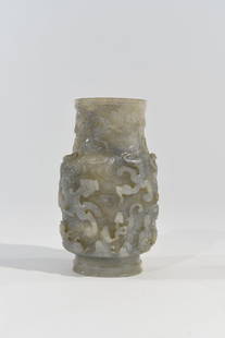 CHINESE CARVED JADE VASE: Dimensions: H 6.75" x W 4.25" x D 3.5" Condition: A few minor flea bites to edge of rim and base. A Few stress fractures to the body of the vase.