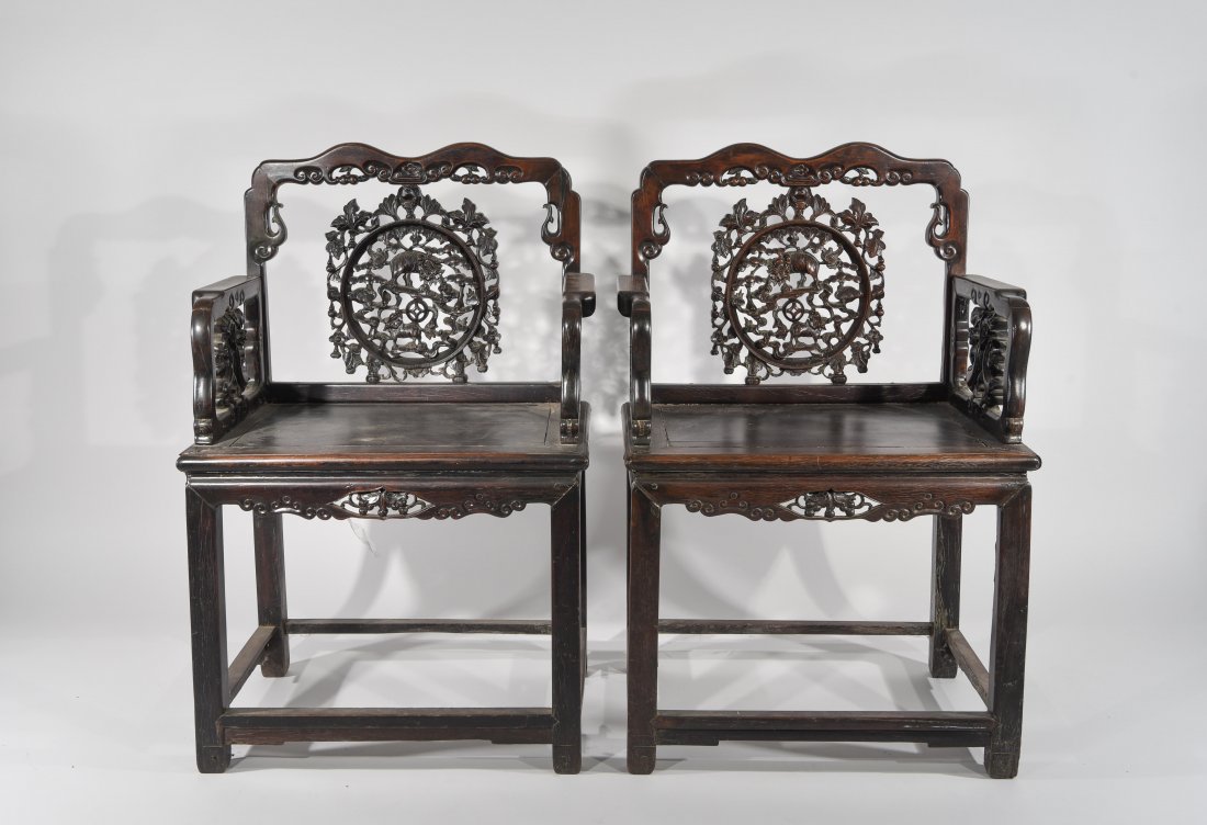 PAIR OF 19TH C. CARVED CHINESE HARDWOOD CHAIRS: Dimensions: H 38" x W 25.5" x D 18.5" Condition: Joint separation front seat of both. Crack in back design of one. Stress cracks in both seats. Few nicks and dings to legs and feet.