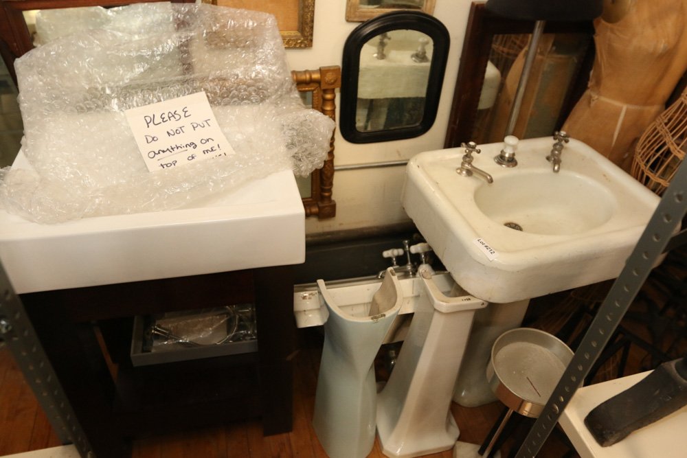 Three pedestal sinks.: Dimensions: H 35" x W 24" x D 20"
