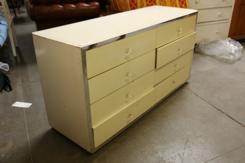Eight drawer mid century white chest.: In the style of Pierre cardin Dimensions: H 29" x W 54" x D 18"