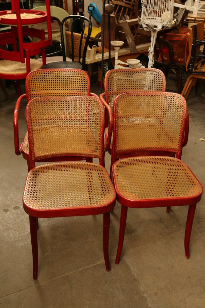 Set of four thonet canned seat and back chairs: consisting of two arm and two side. Chair with Arm Dimensions: H 31" x W 19" x D 21"