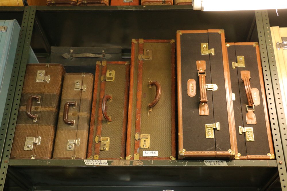 Seven vintage woven and leather suitcases. (1 of 4)