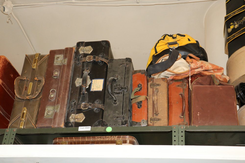 11 assorted vintage cases and carryalls black: and brown in colors. Large Black Dimensions: H 9" x W 24" x D 12"