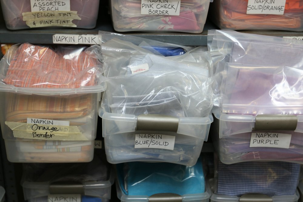 Blue, purple, and orange linen napkins.: Approx. 100-150 sets (bags)