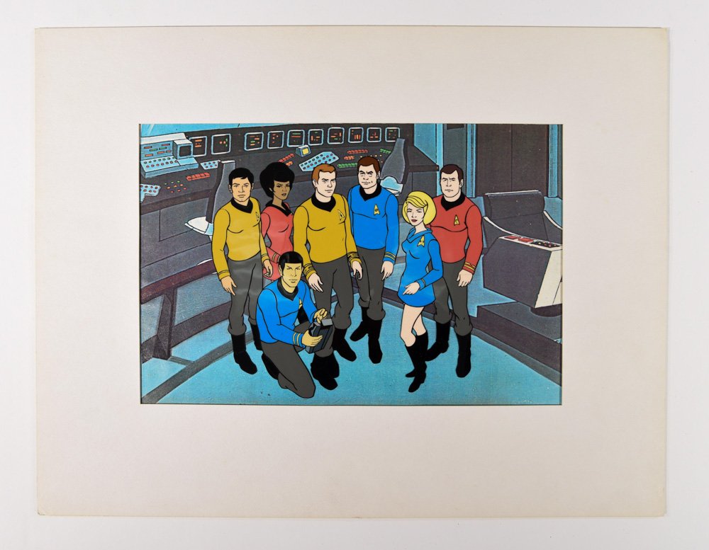 STAR TREK: THE ANIMATED SERIES FILM CELL: Film cell featuring a matte background of the Enterprise bridge, and a clear sheet of plastic with the images of the Enterprise crew. This cell was used by the team producing the animated series and c