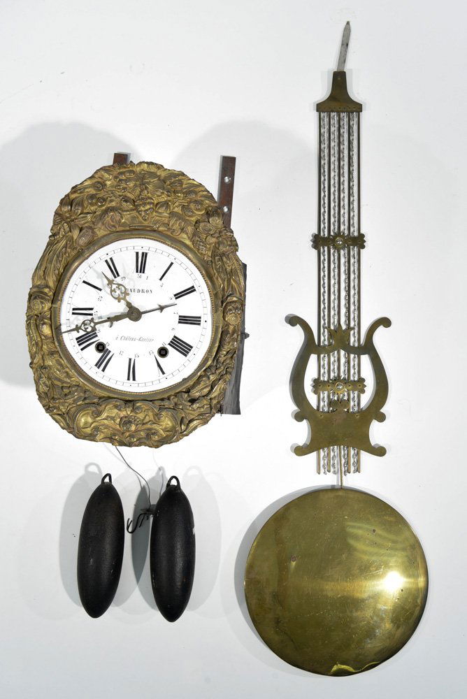 FRENCH WAG-ON-WALL CLOCK: Dimensions: H 53" x W 12.5" x D 7" Condition: Front of brass ornament has separated areas.