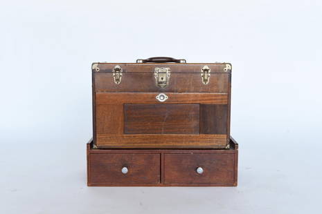 WOODEN MACHINIST TOOLBOX: Gertsner & son Dimensions: H 18" x W 22" x D 10.25" Condition: Some scratches, scuffs, and scrapes to surface and face. Chips and gouging to base (especially where tool box mounts to base). Some pitti