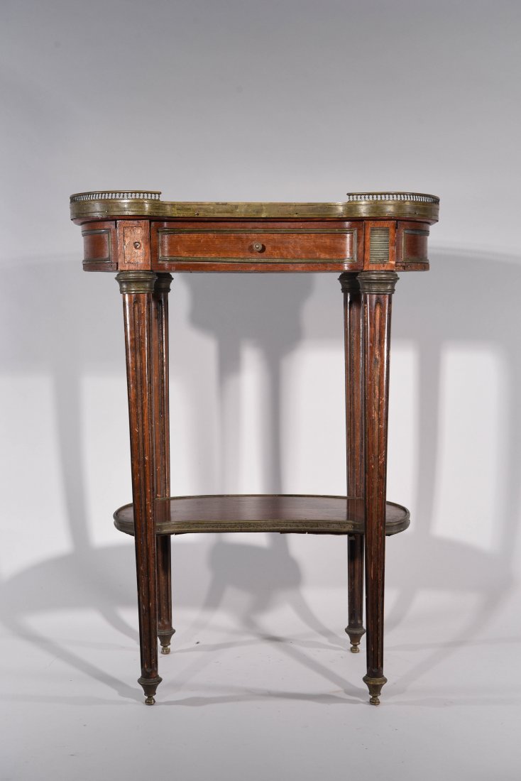 FRENCH TABLE WITH GALLERY: Double brass gallery with decorative mounts and with marble top. Dimensions: H21" x W21.5" x D12" Condition: good,front left side leg has a screwed and missing some veneer throughout with missing bras