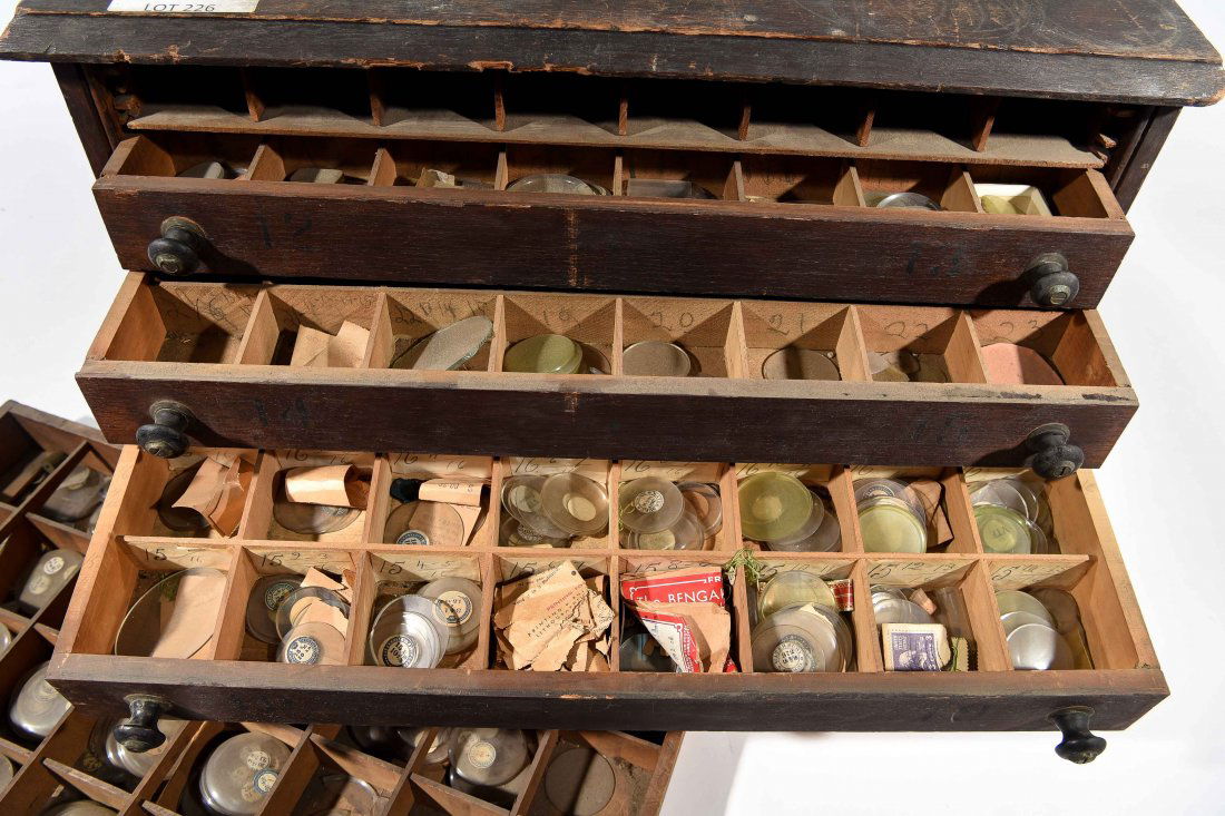 CABINET OF POCKET WATCH AND CHRONOMETER CRYSTALS (1 of 8)